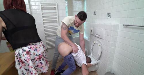 Having Fun On a Public Toilet With a Strap On